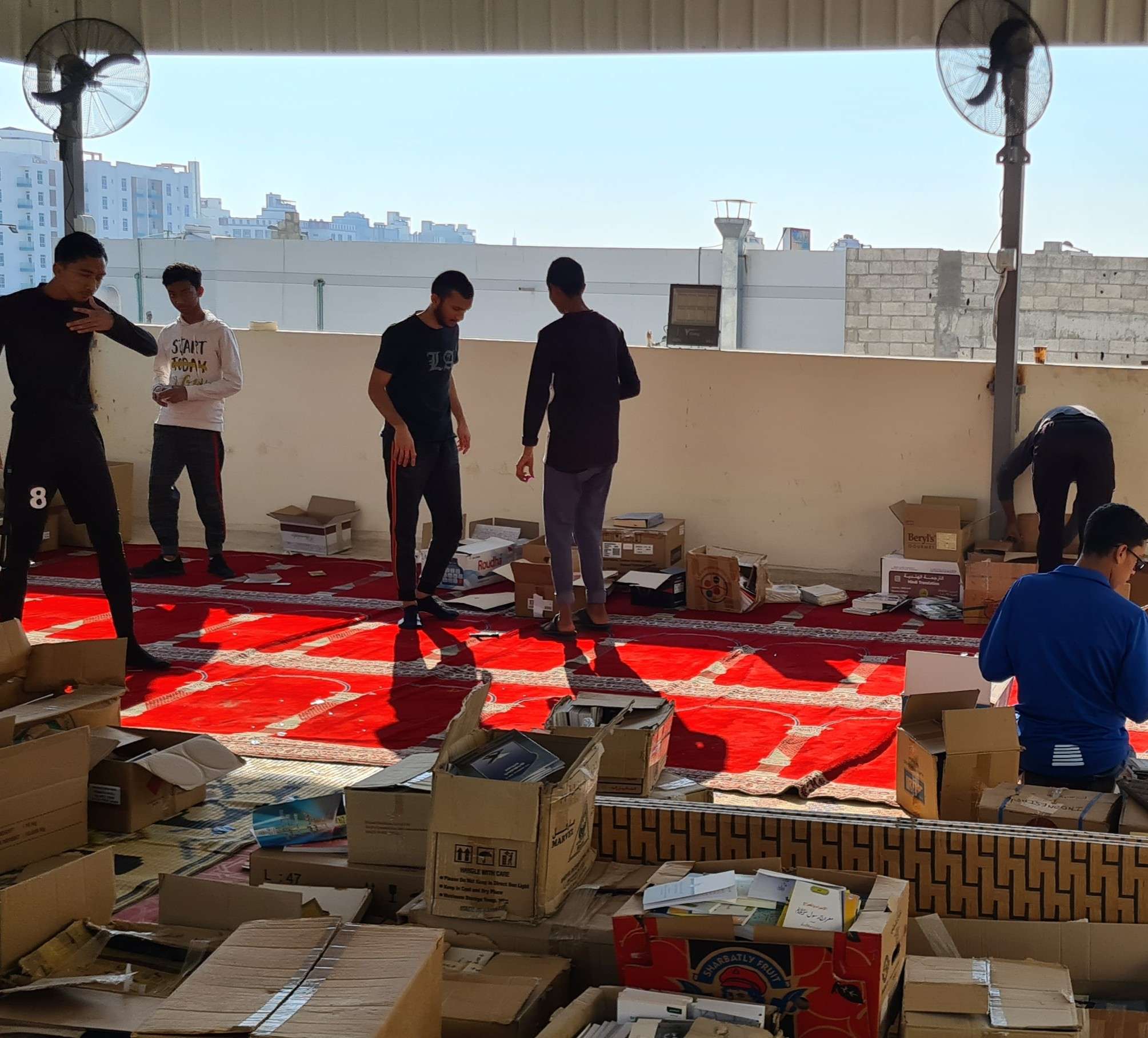 Volunteers help organize storage facility